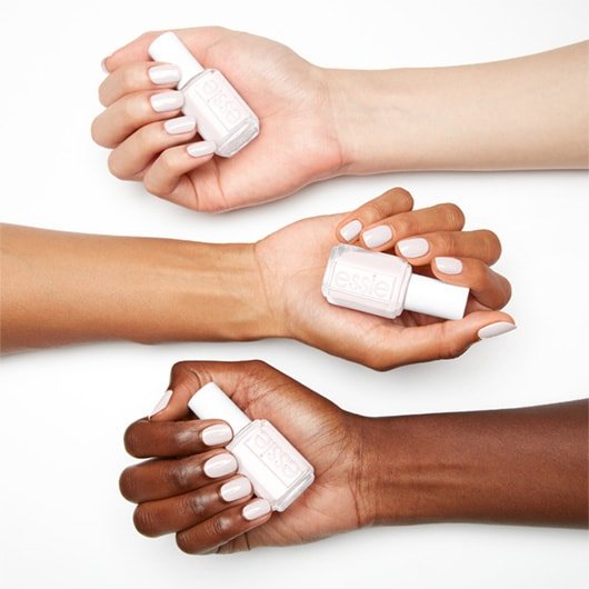 stay fluid white nail polish with pearl effect on 3 skin tones